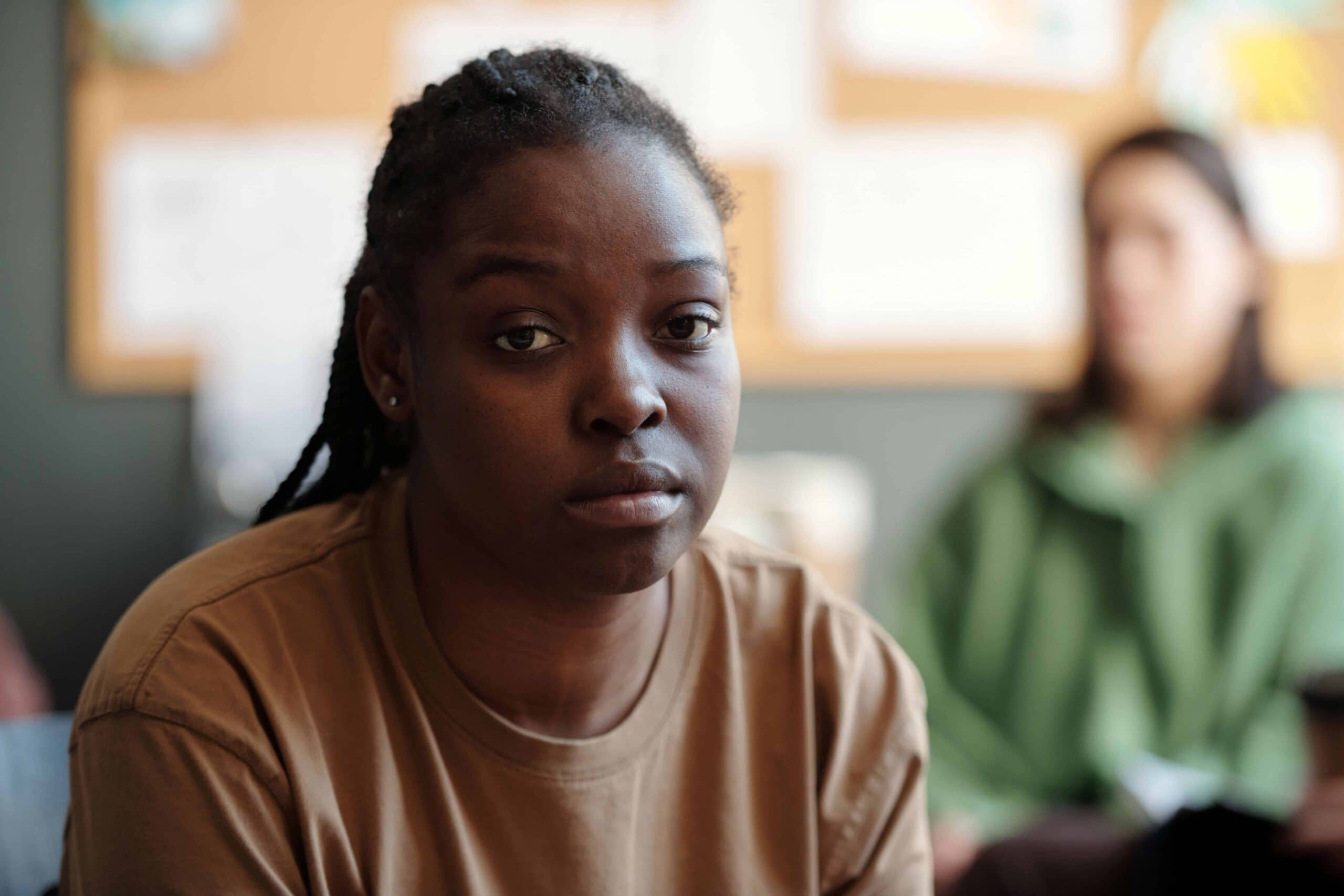 Black woman looking distressed after finding out How Much Cocaine It Takes to OD?