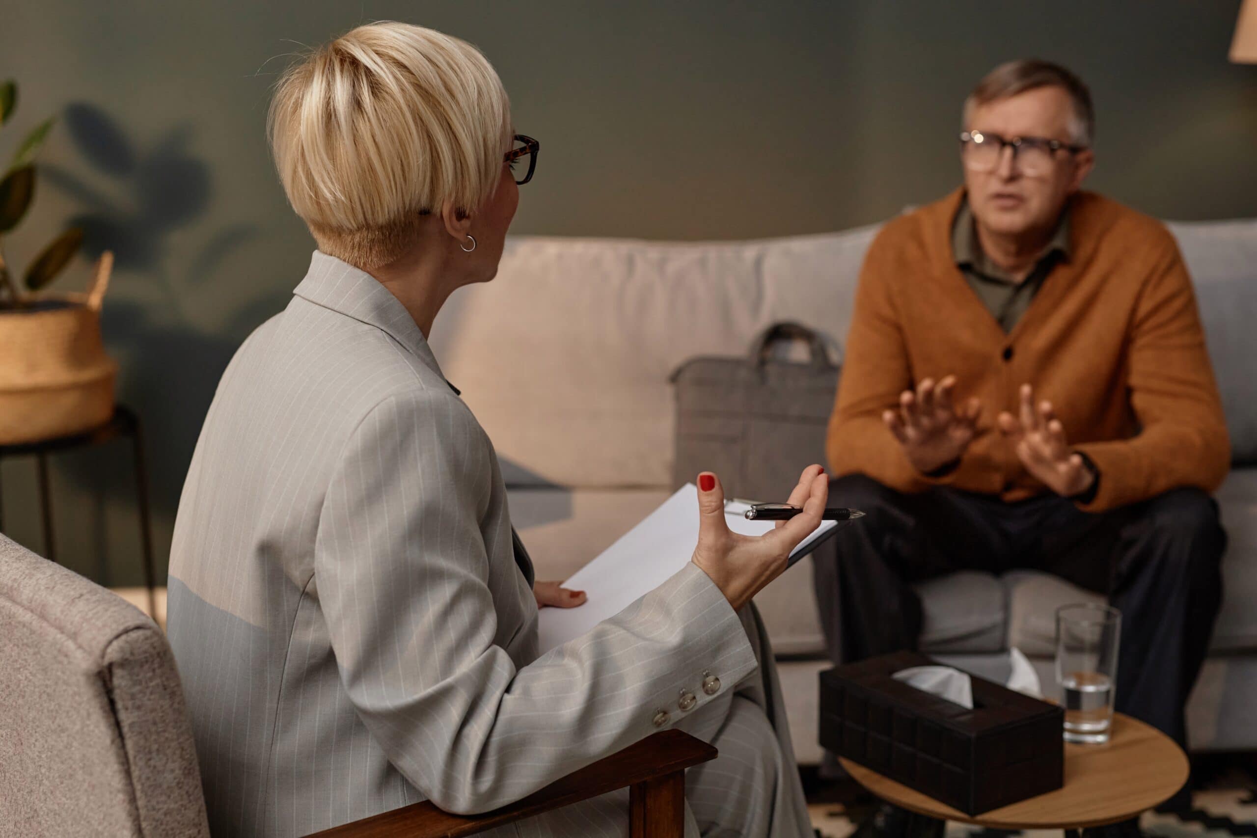 Man talking to woman in therapy about individual therapy for addiction.
