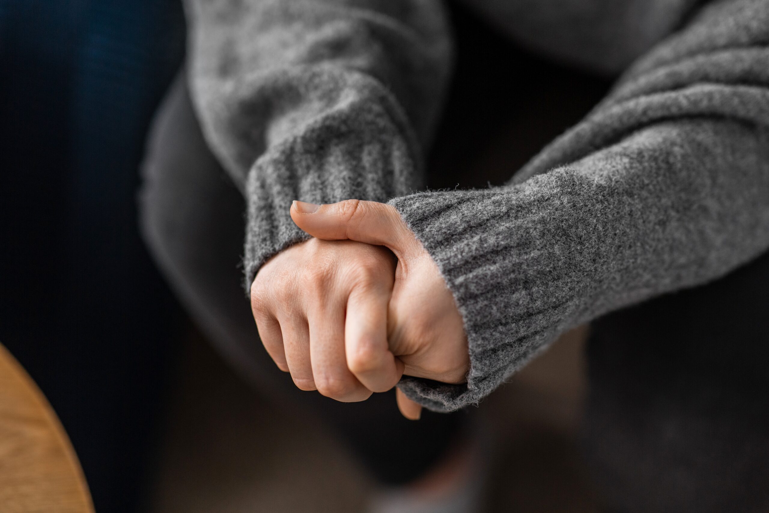 Woman with anxious hands asking herself How Long Does It Take to Detox from Meth?